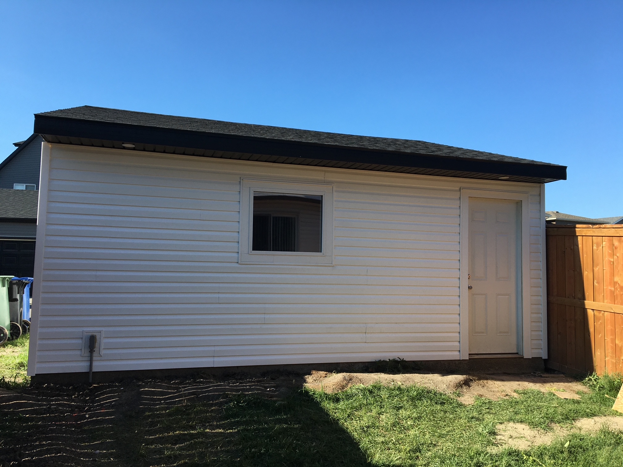 Backyard view of detached garage in Seton